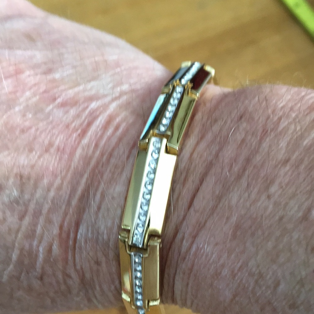 Beautiful Gold tone bracelet with white stones.